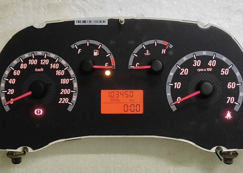 Car instrument cluster with analog dials and a digital display at King of Meter